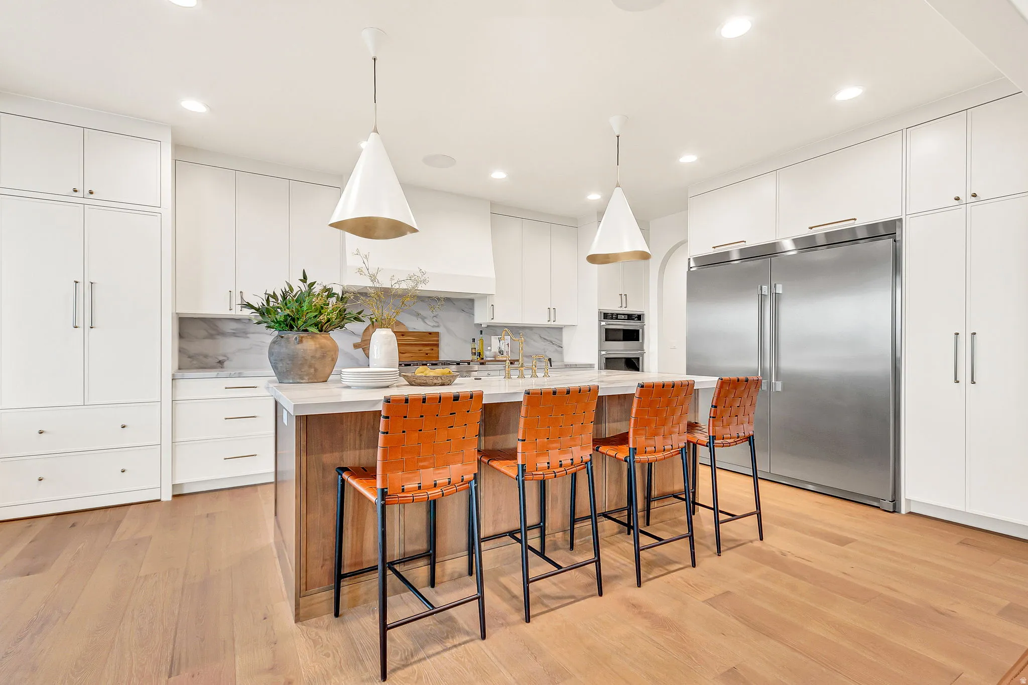 Gourmet kitchen with hidden pantry door to a large walk-in  pantry