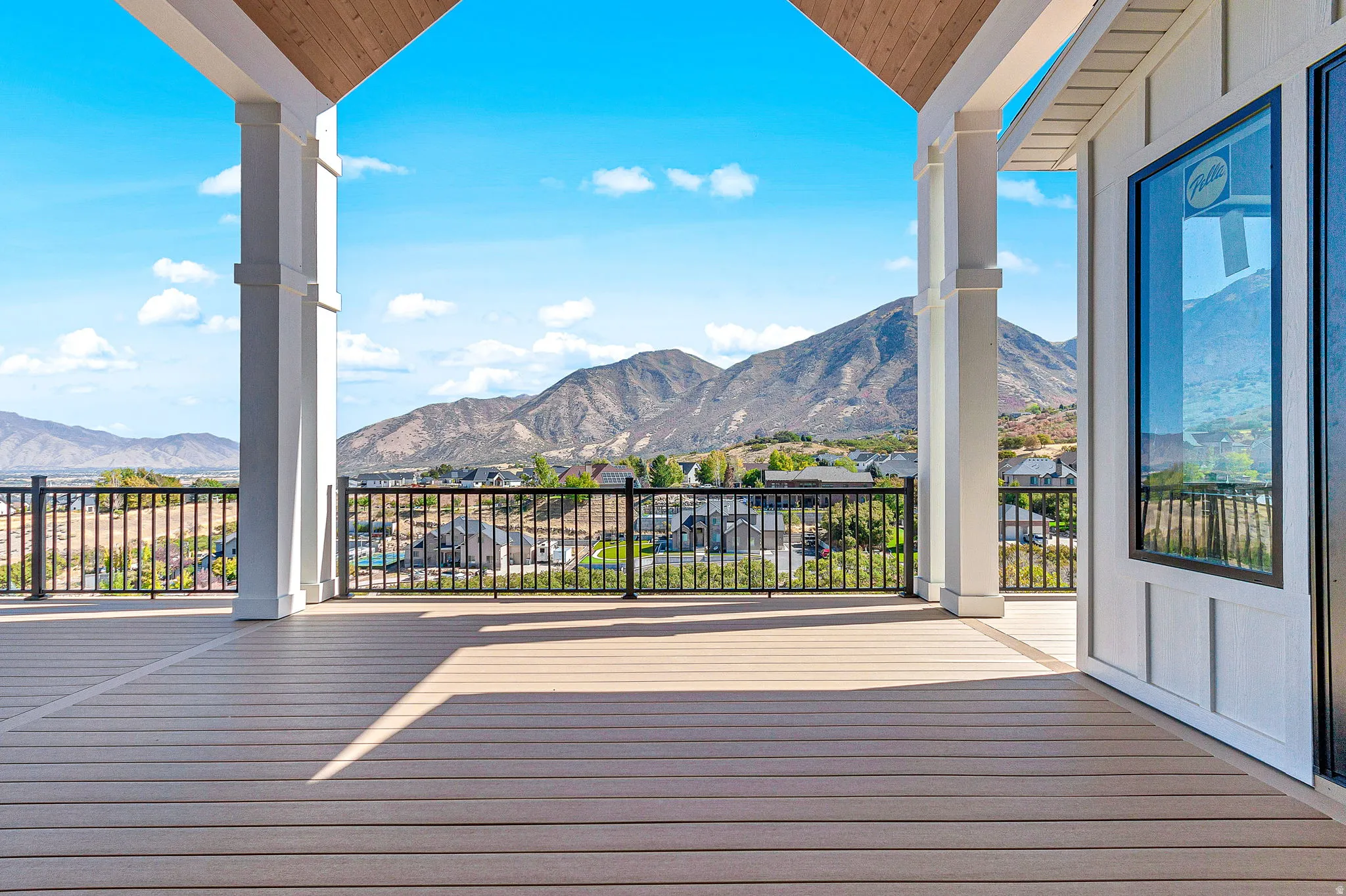 View from the glass sliding doors of the covered deck off the main level living room