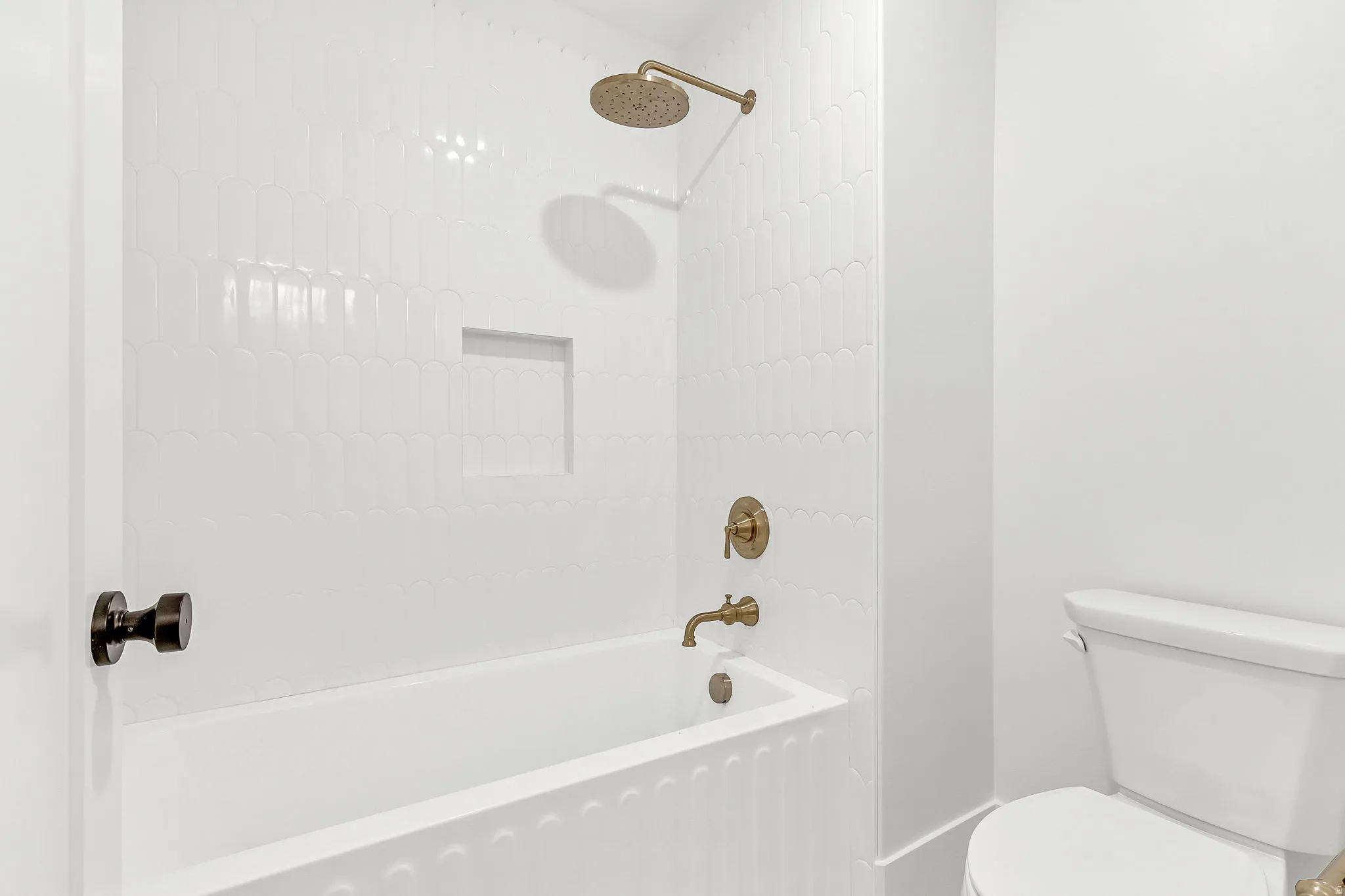 Upstairs bathroom 2 featuring tile surround