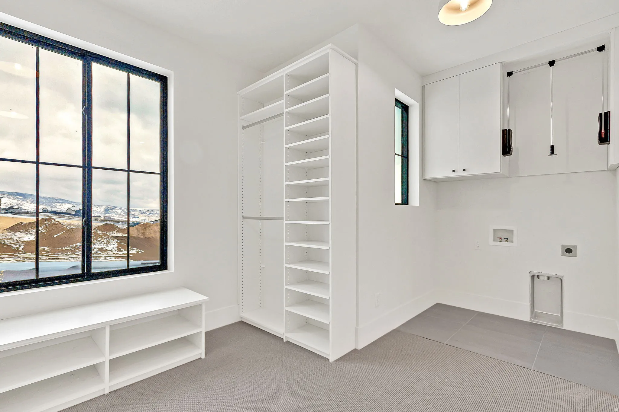 Primary closet featuring a washer and dryer station