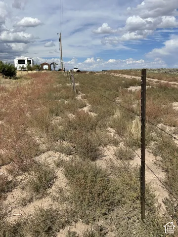 View of yard with a rural view