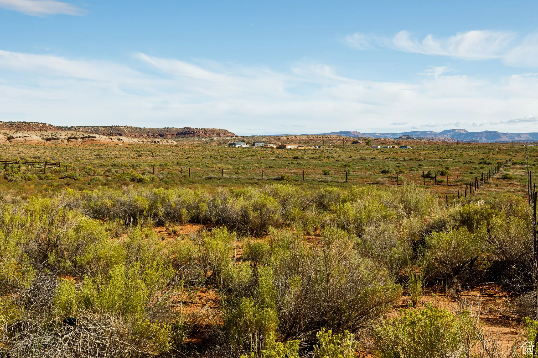View of undeveloped land featuring a mountain backdrop and rural landscape