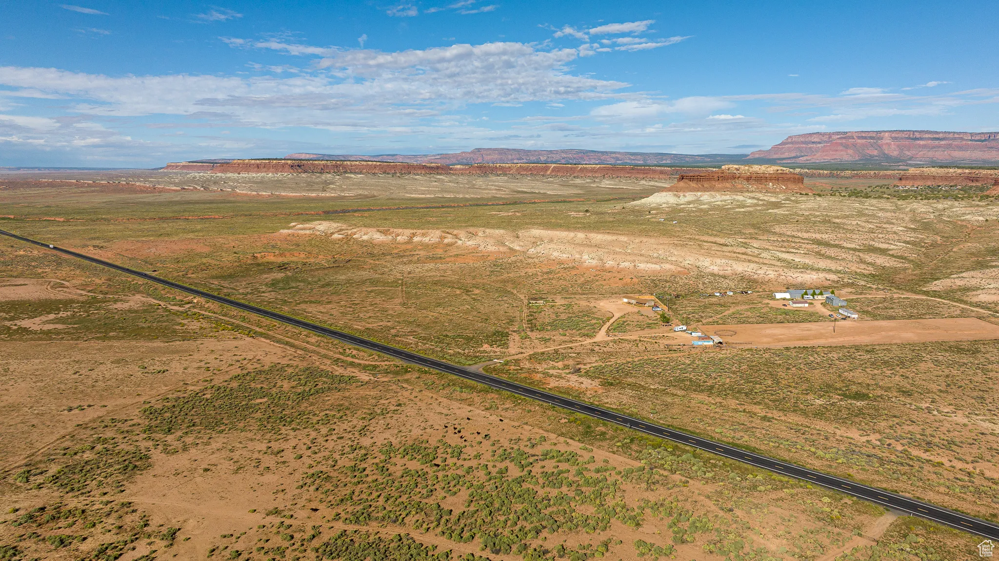 Aerial view of sparsely populated area featuring a mountainous background
