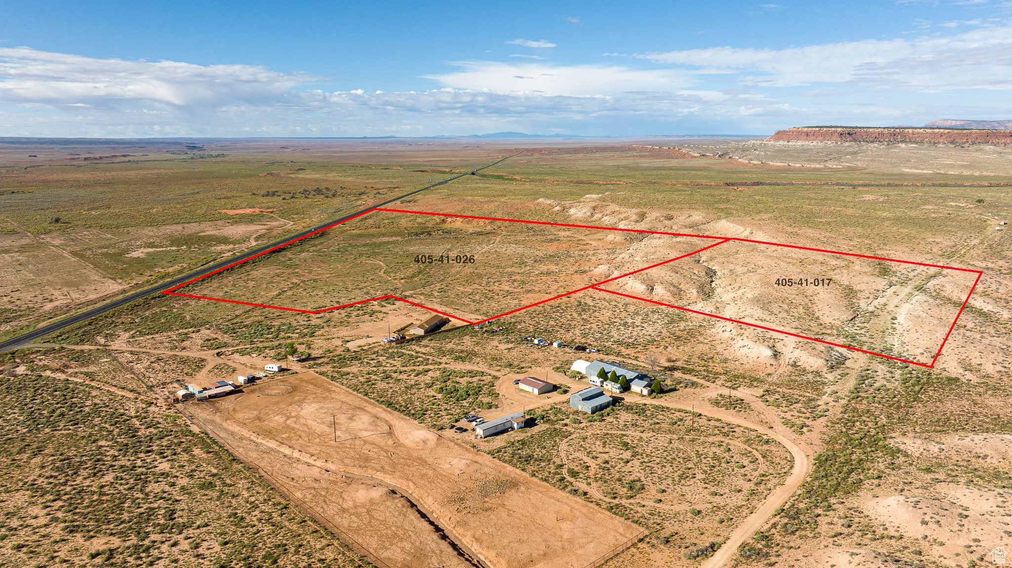 Aerial view of sparsely populated area featuring property parcel outlined and a desert landscape