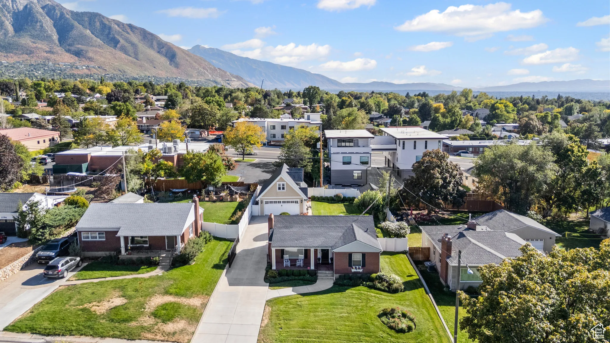 Aerial view of residential area featuring mountains