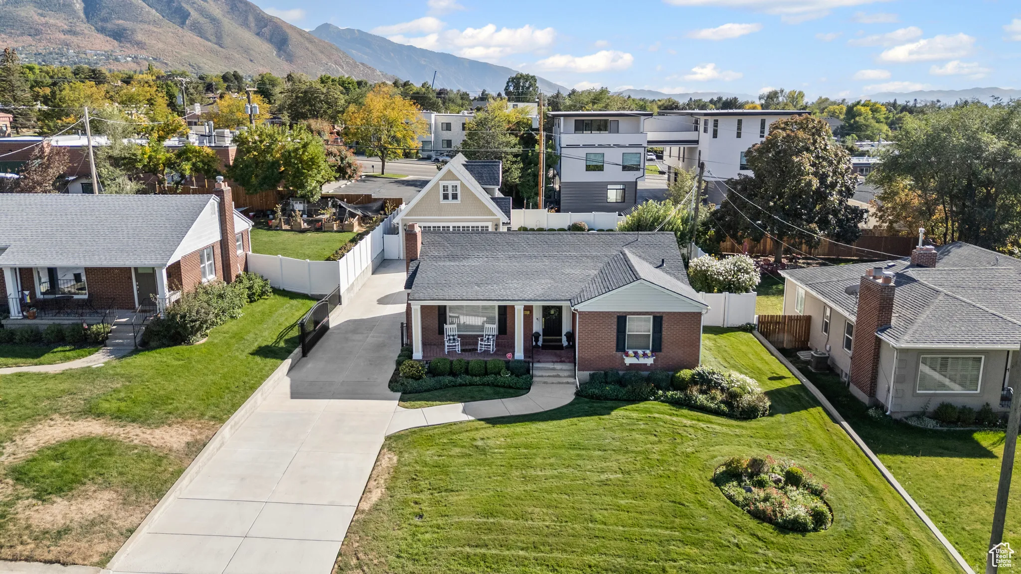 Aerial view of residential area featuring a mountainous background