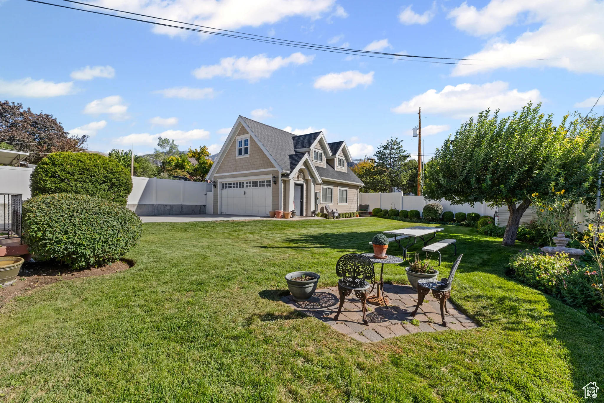View of yard with a patio and a garage