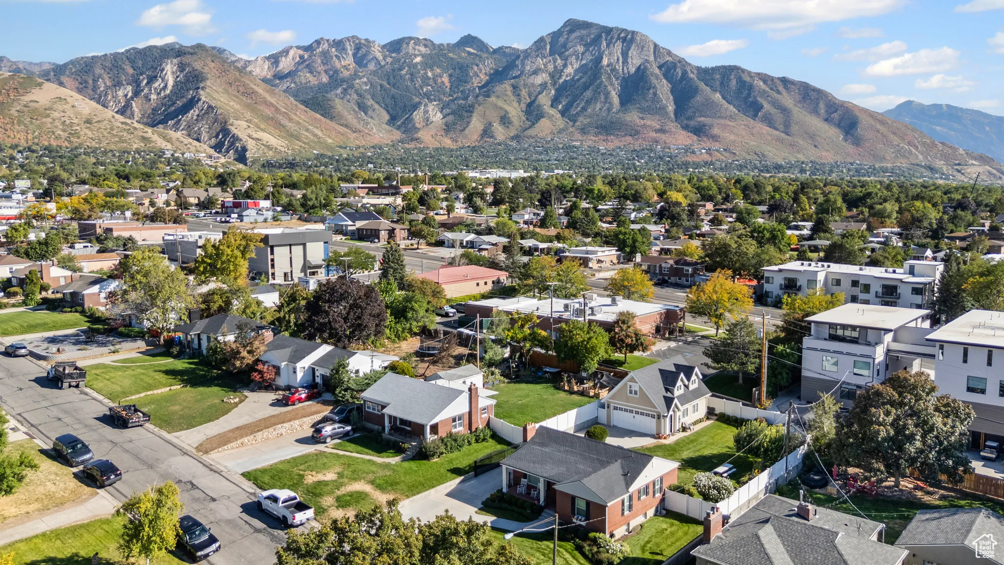 Aerial perspective of suburban area featuring a mountainous background