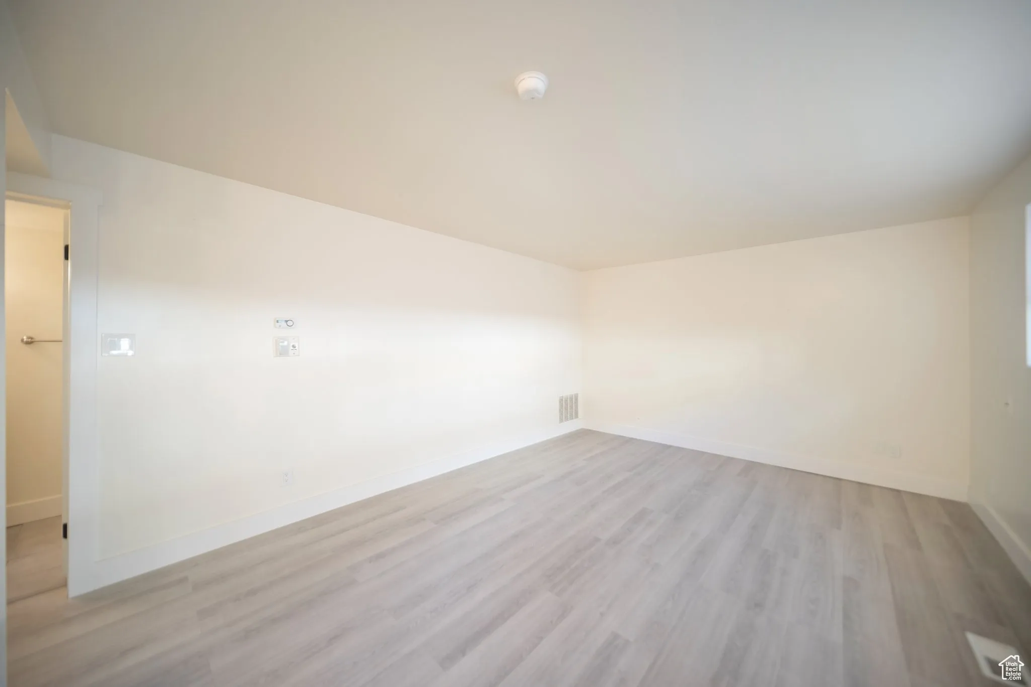 Empty room featuring light wood-style floors