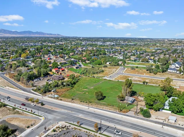 Aerial perspective of suburban area featuring a mountain backdrop
