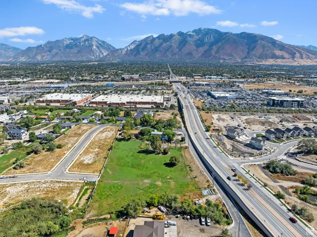 Aerial view of a mountainous background and a highway