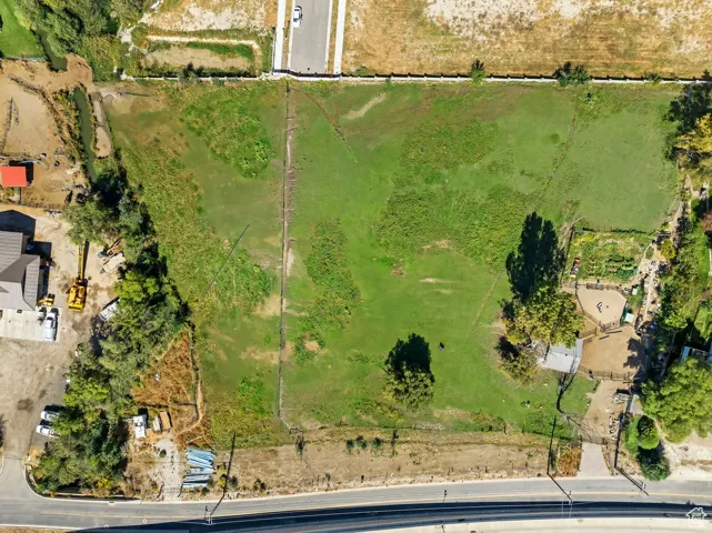 Aerial view of property's location featuring rural landscape and a pastoral area