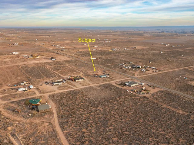Aerial view of property and surrounding area featuring rural landscape