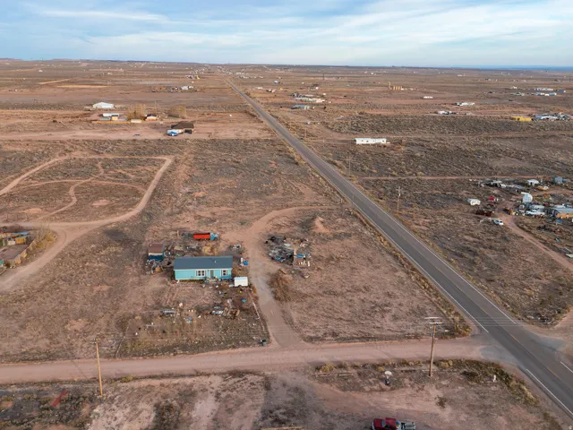 Aerial overview of property's location featuring rural landscape and property boundaries highlighted