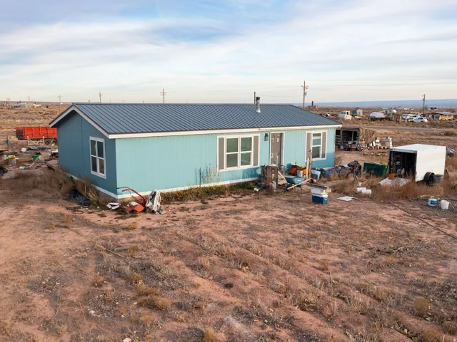 View of front of property with a metal roof