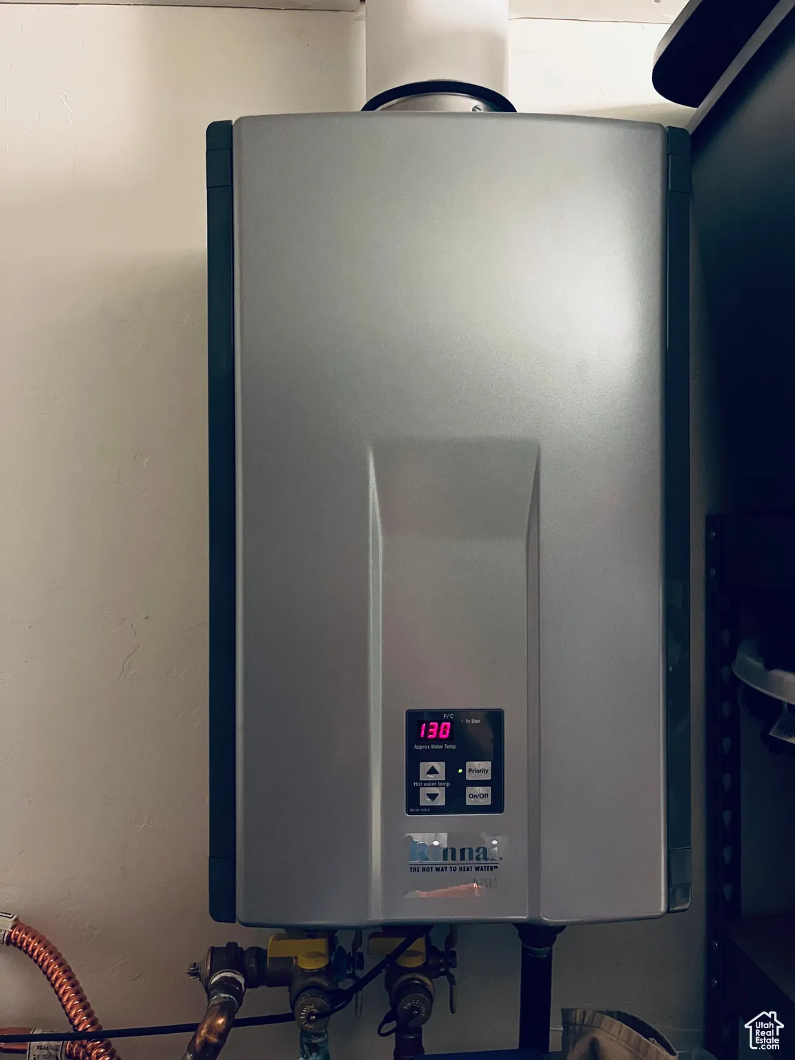 Detailed view of one of two tankless water heaters both identical.