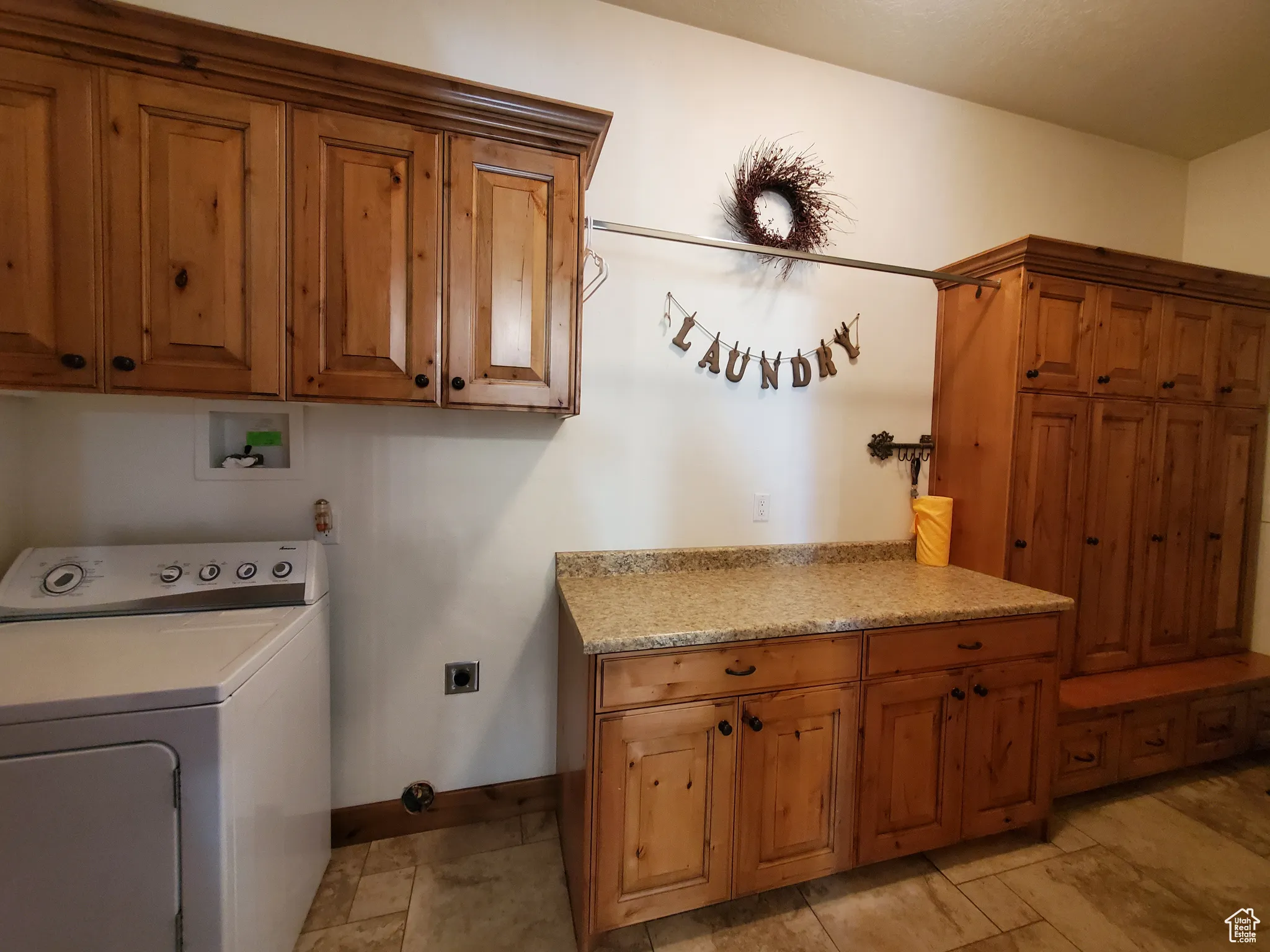Laundry room featuring washer / dryer and cabinet space