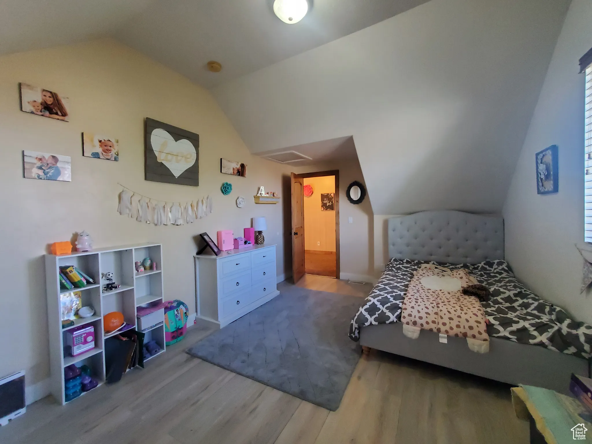 Bedroom #3 upstairs featuring vaulted ceiling and light wood-style flooring