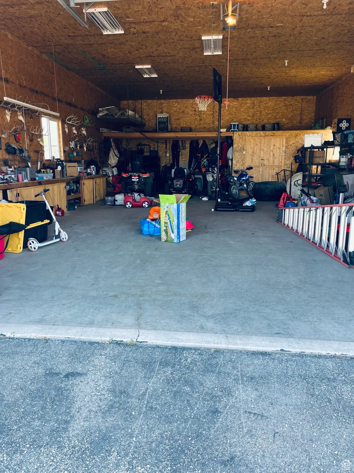 Garage with a workshop area this is the front shop with storage