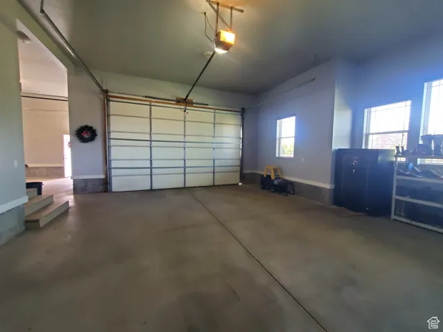 Attached Garage featuring a garage door opener