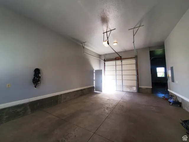 Attached Garage featuring electric panel and extra deep.