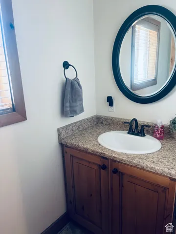 Half Bathroom with vanity off of the laundry room.