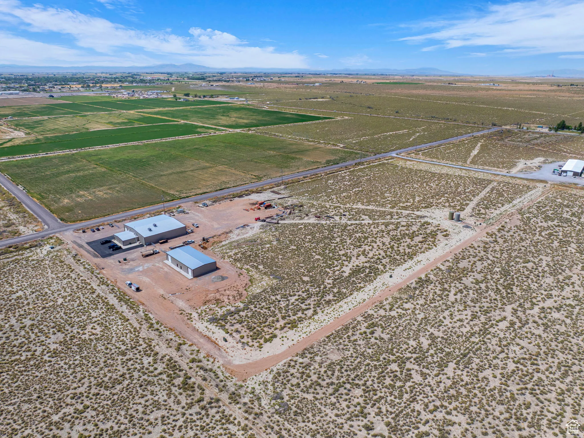 Aerial view of sparsely populated area with a mountain backdrop