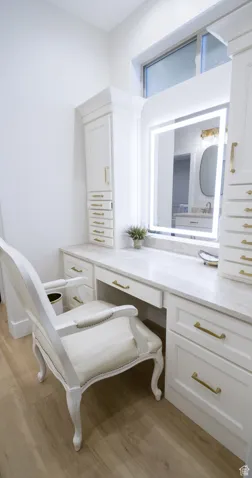 Bathroom with light wood-type flooring and vanity