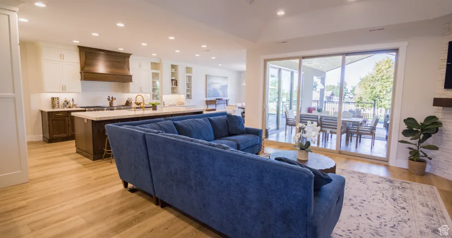 Living room featuring recessed lighting and light wood-type flooring