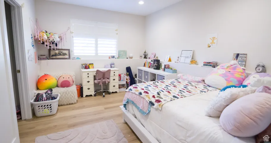 Bedroom featuring light wood-style flooring and recessed lighting
