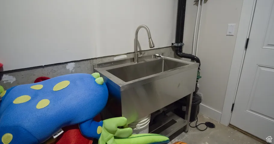 Detailed view of concrete flooring and a sink