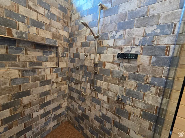 Full bathroom with a tile shower