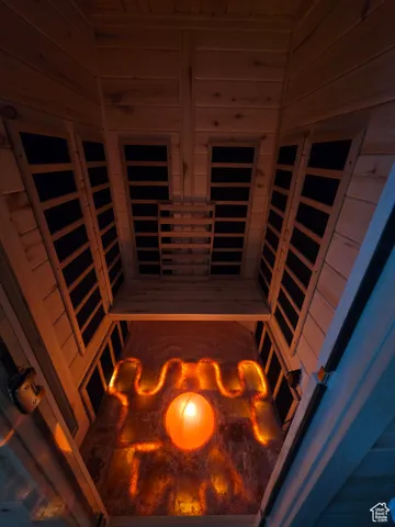 Sauna / steam room featuring wooden walls and wooden ceiling