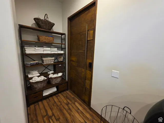 Corridor with dark wood-style floors