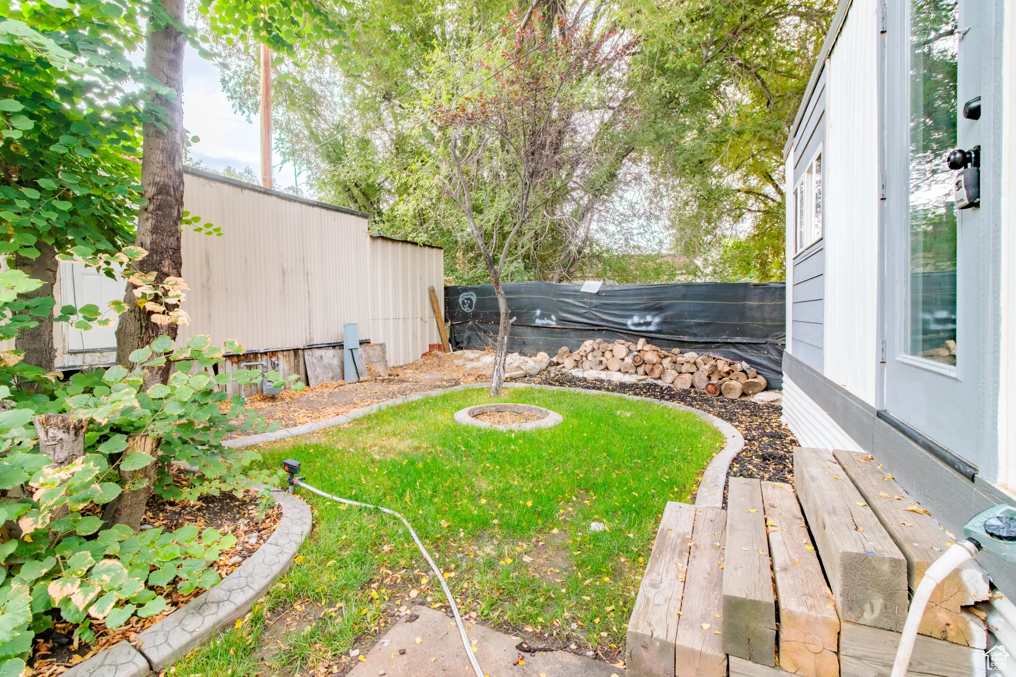 View of fenced backyard
