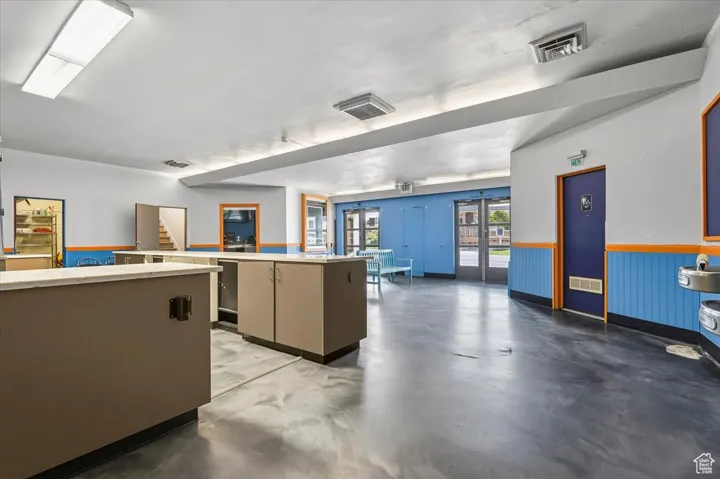 Theater Lobby with a wainscoted wall and stairs