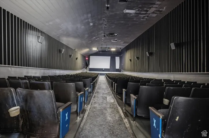Home theater featuring dark colored carpet