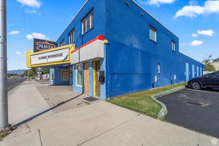 View of property with uncovered parking