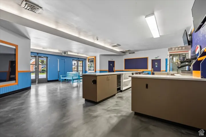 Theater Lobby with concrete flooring and light countertops