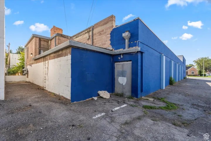 View of side of property with concrete block siding