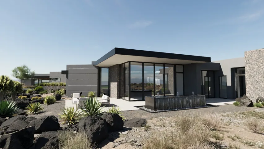 Rear view of property with a patio and stucco siding