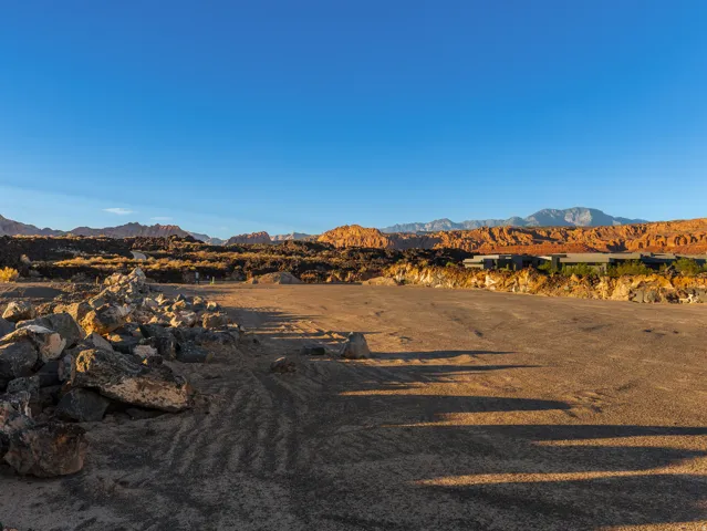 Expansive lot featuring rugged terrain and distant mountain ranges