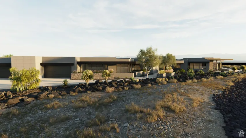 Contemporary house featuring concrete driveway, a garage, and stucco siding