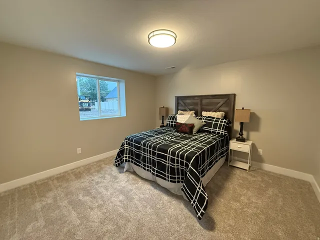 Carpeted bedroom with baseboards