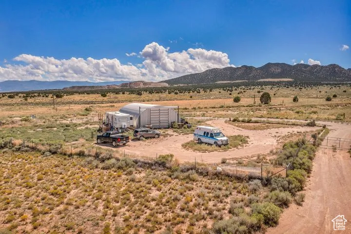 View of mountain backdrop with rural landscape and a desert landscape