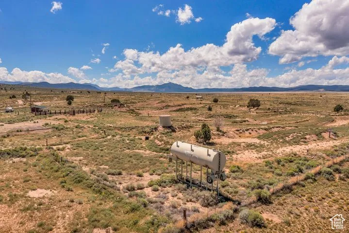 View of mountain backdrop with rural landscape