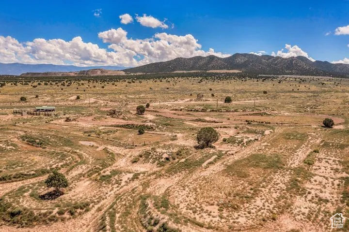 View of mountain backdrop featuring rural landscape and a desert landscape
