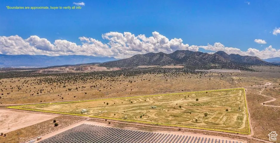 View of mountain backdrop featuring rural landscape