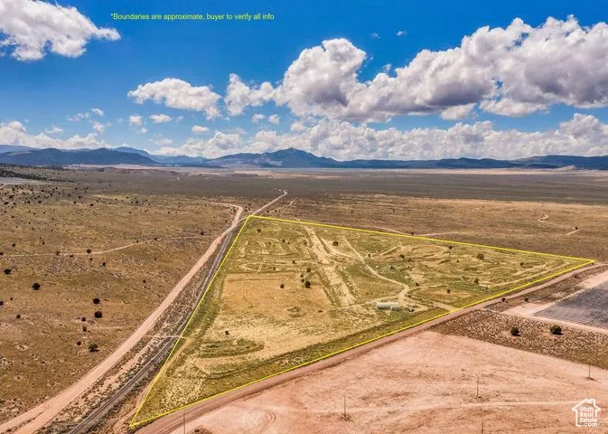 Aerial view of sparsely populated area featuring a mountainous background