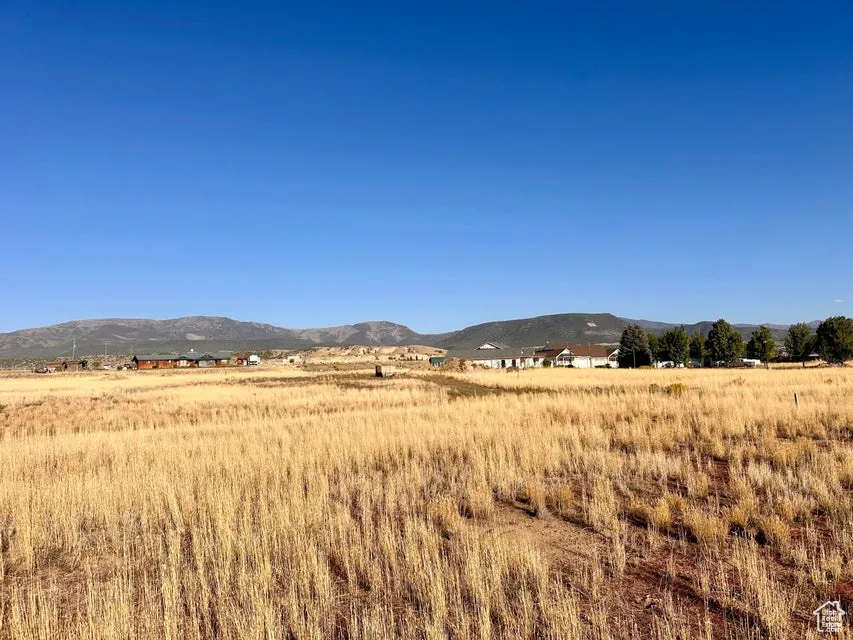 View of mountain backdrop featuring rural landscape